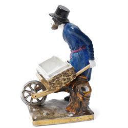 Russian, probably Gardner figure of a man pushing a wheelbarrow on gilt lined rectangular base, impressed mark, H16cm, 18th century creamware beaker with star shape decoration, 18rh century Worcester cup with panels of flowers on a blue ground and a French shell shape scent flask (4)