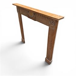 19th century Adams design pine fire surround, egg-and-dart carving over Vitruvian scrolls and fluted frieze, decorated with applied carved festoons and garlands, on fluted uprights