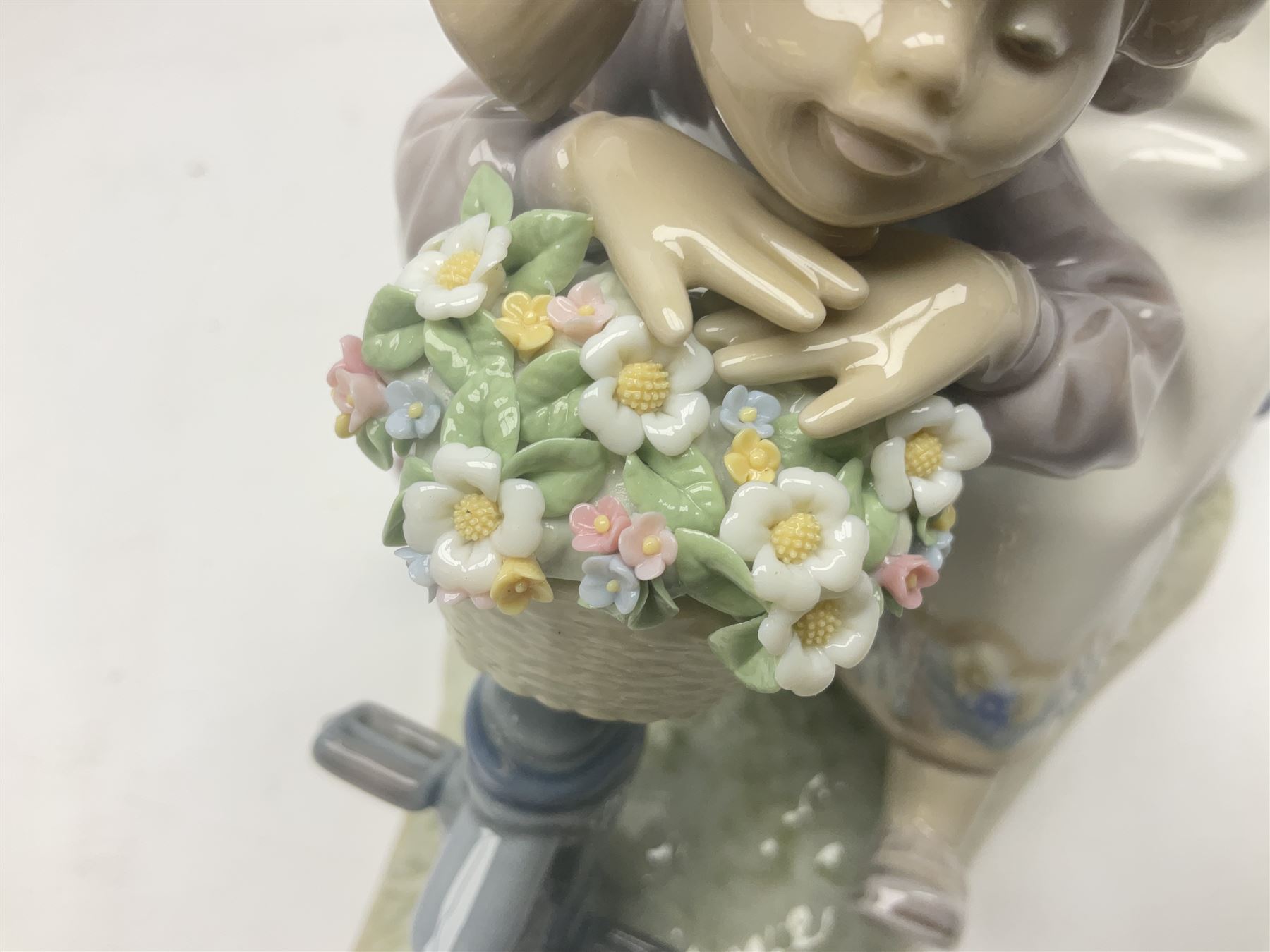 Lladro figure, In No Hurry, modelled as a girl on a tricycle, sculpted by Francisco Polope, with original box, no 5679, year issued 1990, year retired 1994, H15cm