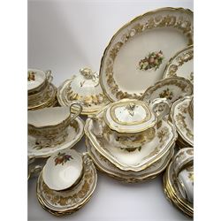 Extensive Spode dinner and tea service, decorated in the Golden Valley pattern, comprising eighteen dinner plates, ten salad plates, ten side plates, ten twin handled soup bowls and ten saucers, ten bowls, two sauce boats and two stands, two square serving dishes, smaller oval serving dish, two tureens and covers, two large oval serving platters, one smaller example, teapot, coffee pot, milk jug, twin handled lidded sucrier, and ten teacups and ten saucers, with red printed marks beneath 