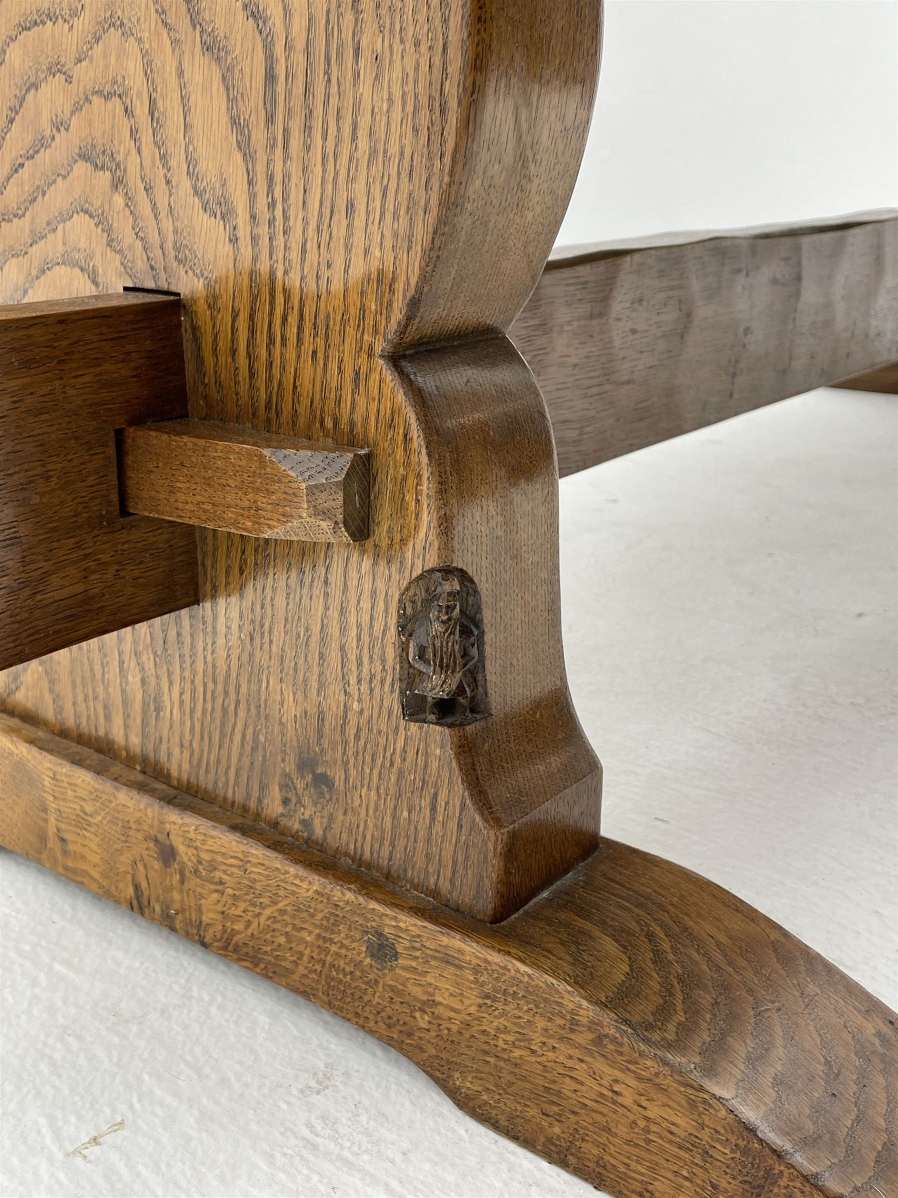 ‘Gnomeman’ oak dining table, rectangular adzed top, shaped end supports on sledge feet joined by pegged stretcher, carved with gnome signature, by Thomas Whittaker of Littlebeck