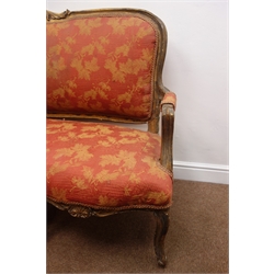  19th century gilt framed serpentine front settee, carved cresting rail, upholstered back, seat and arms with a red and gold floral fabric, cabriole supports, W170cm  