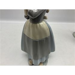 Three Lladro figures, comprising Dutch Girl with Braids no 5063, Dutch Girl with Duck no 5066 and Aracely with Ducks, all with original boxes, largest example H25cm