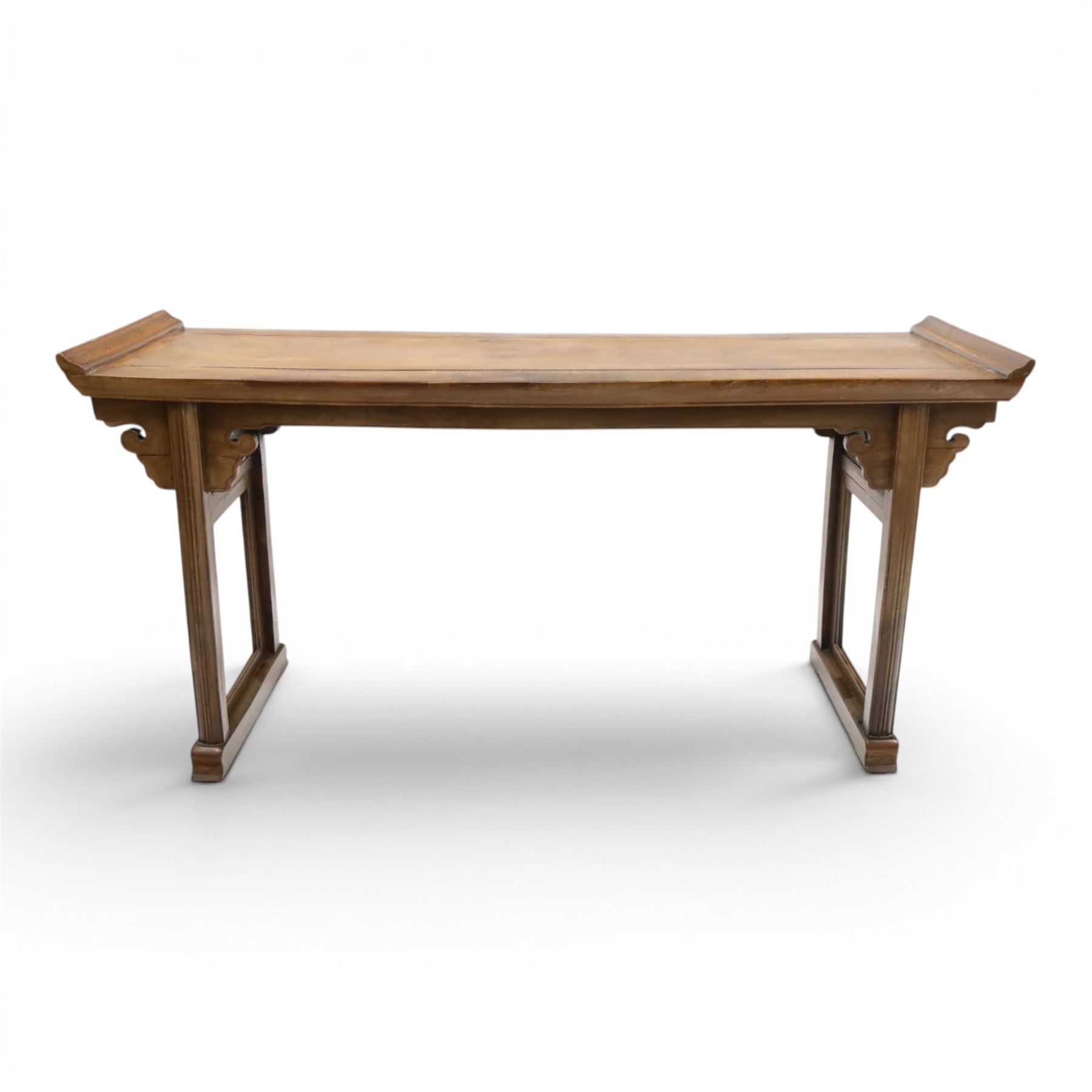 Chinese elm altar table, rectangular plank top with galleried sides, raised on reeded square supports with scrolled spandrels