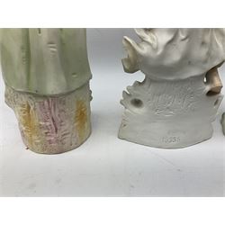 Late 19th century continental spill vase as a young girl standing beside an open tree trunk H21cm; and three German bisque figures (4)