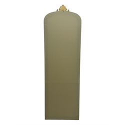 Narrow Victorian design gilt framed wall mirror, anthemion and scrolled acanthus leaf pediment over moulded frame, plain mirror plate 