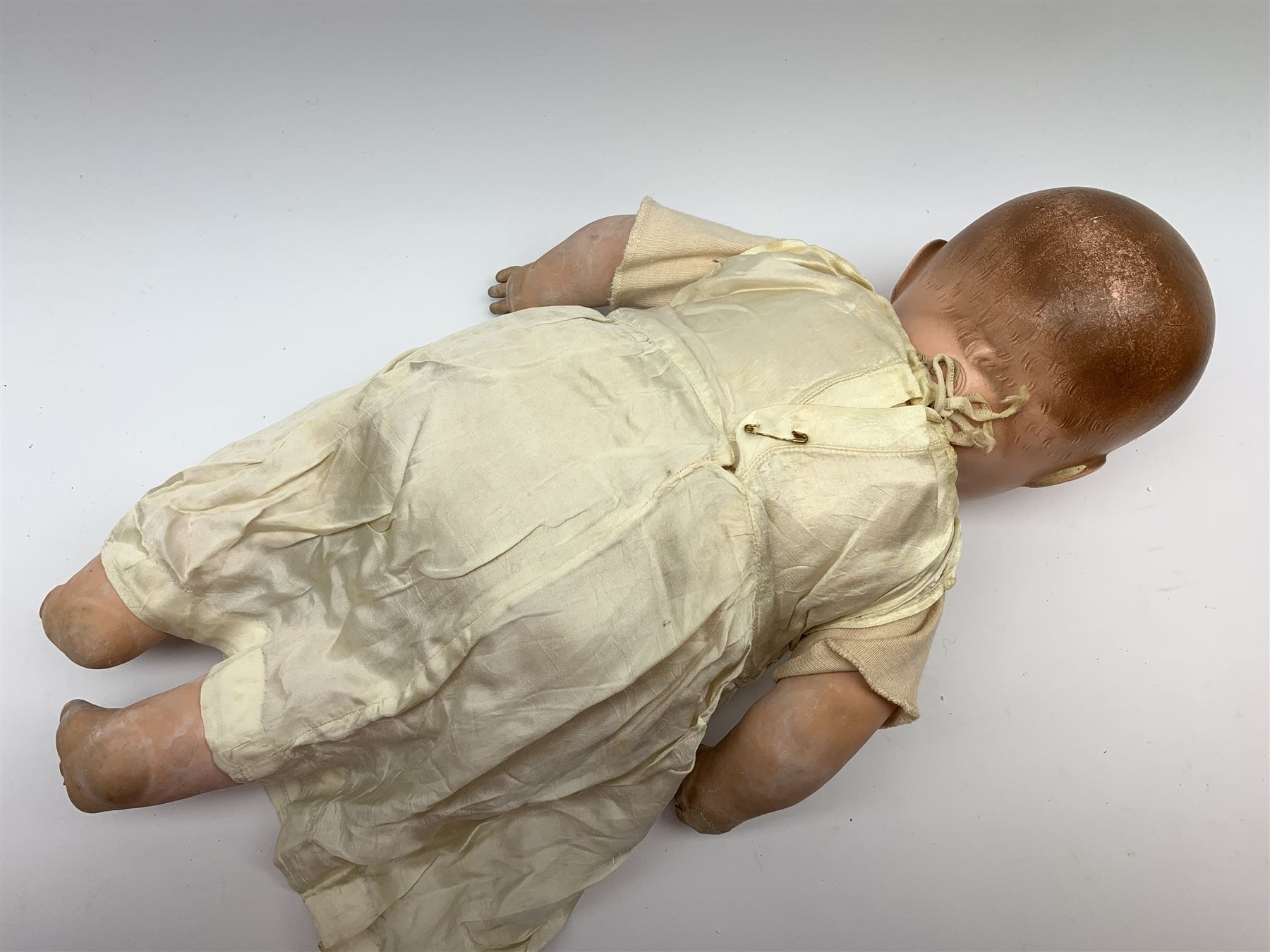 Seyfarth & Reinhardt composition head baby doll with moulded hair, sleeping flirty eyes, open mouth with one tooth and tongue and soft body with composition jointed limbs, marked 'SuR Germany 30/5' H47cm; together with a Golborne Dolls 'Golborne Beauty' composition head and body bride doll, marked 'F.P.23' in original box H63cm (2)