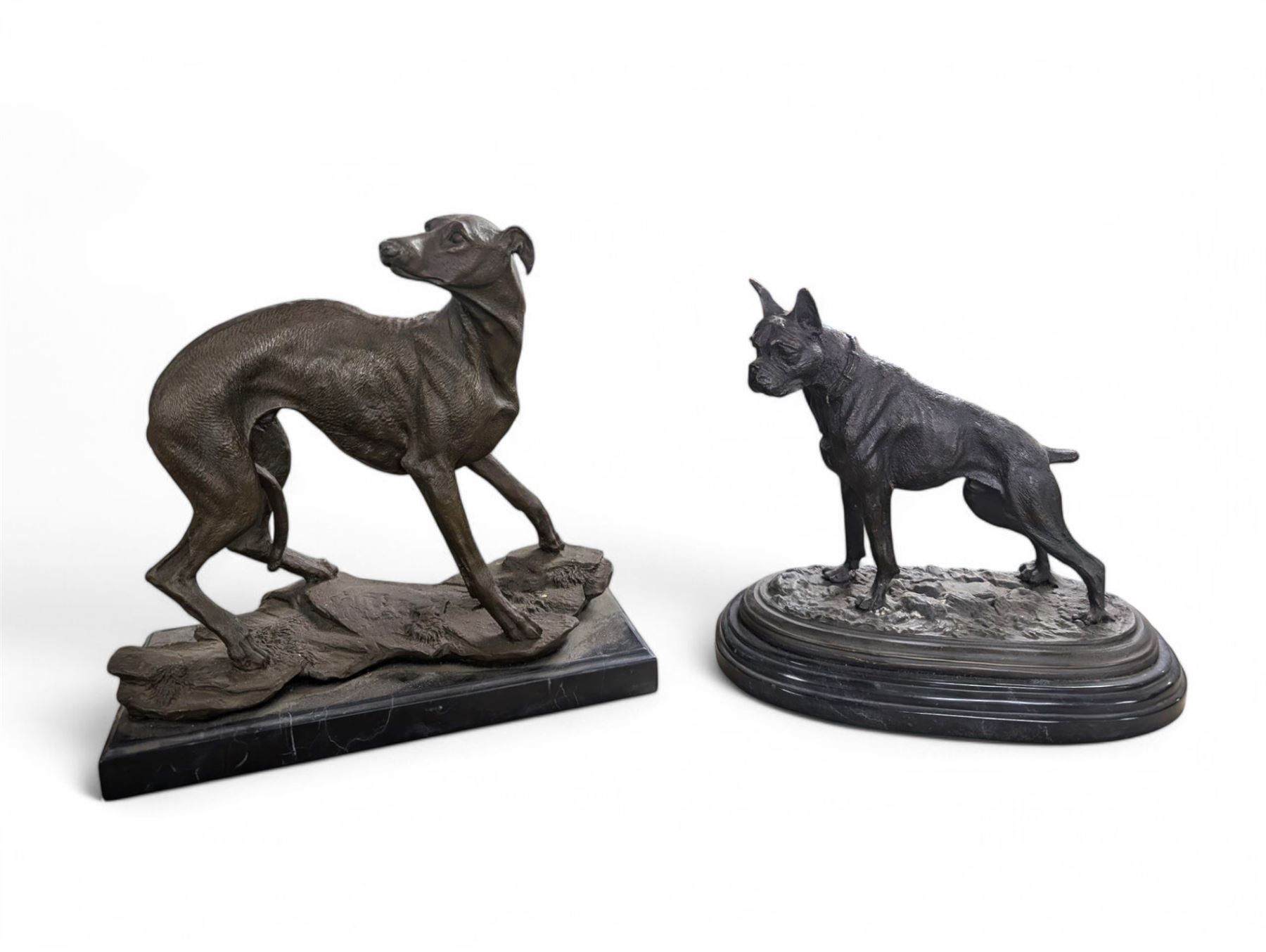 Two spelter dog figures, each upon hardstone bases, tallest H33cm