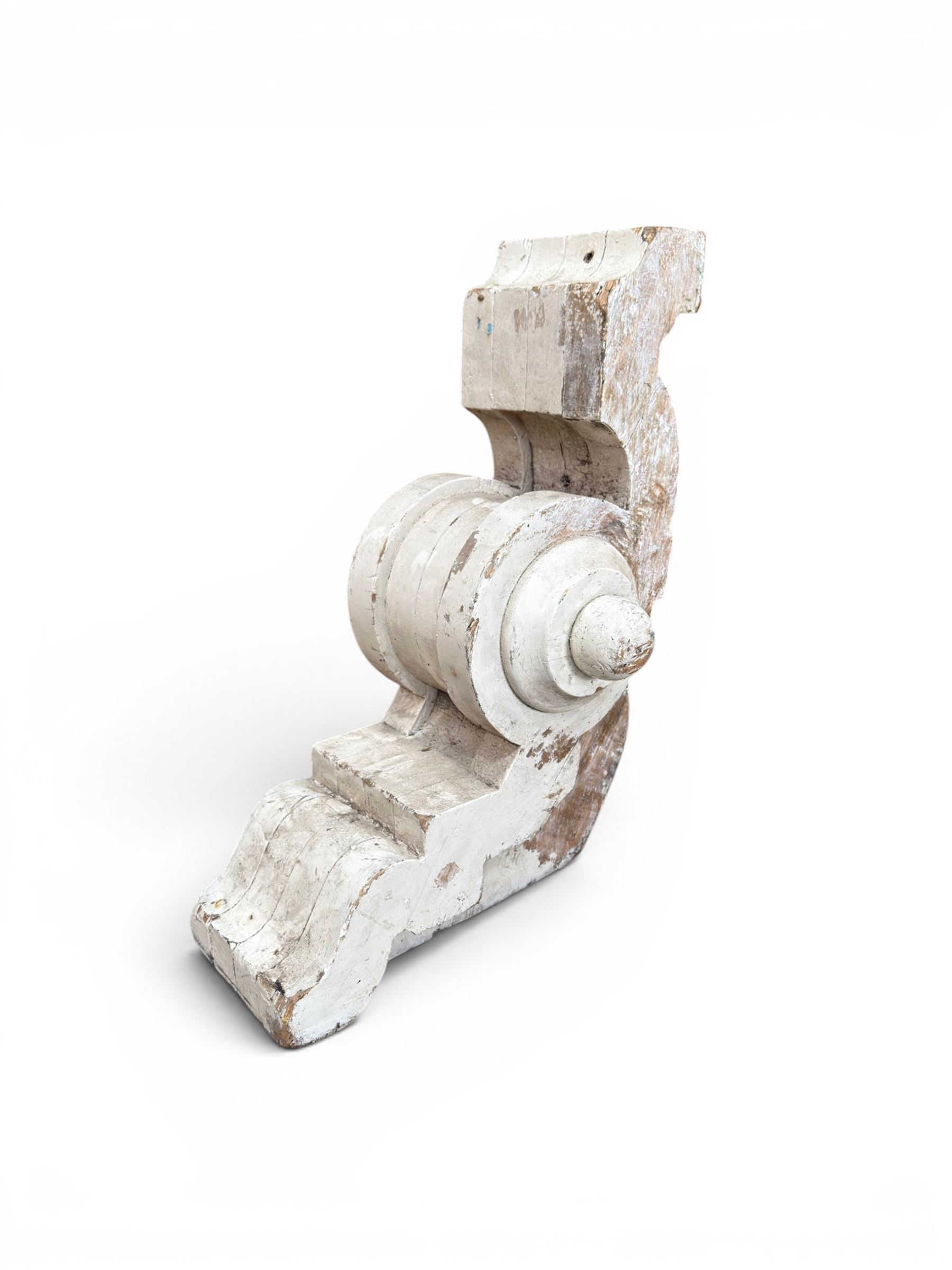 Pair of 19th century stripped pine columns  with carved capitols; an a pair of painted scroll architectural capitols (4)