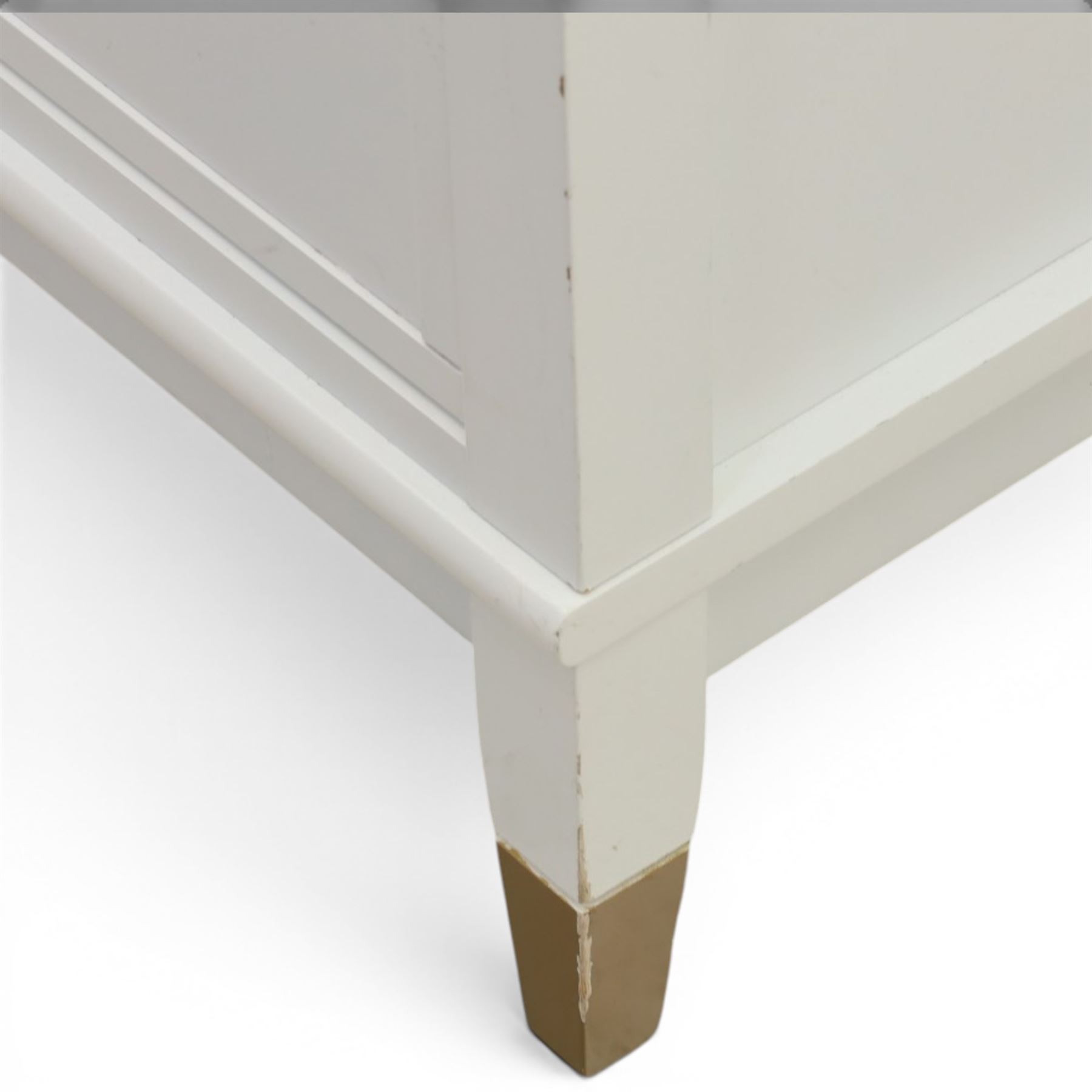 Dorel Home - Modern chest of drawer, white painted rectangular top above, four drawers with bronze metal handles, on tapered supports 