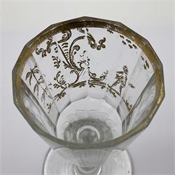 Three 18th century wine glasses comprising a plain stemmed glass with bell shaped bowl and conical folded foot H16cm, another plain stemmed glass with ogee bowl and folded foot and a Continental glass with gilt faceted bowl, decorated with male figure within a landscape, on a clear Silesian seven sided cut stem (3)