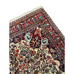 Persian Bidjar ivory ground carpet, decorated all-over with stylised floral motifs and interlacing branch, five band border decorated with flower heads 