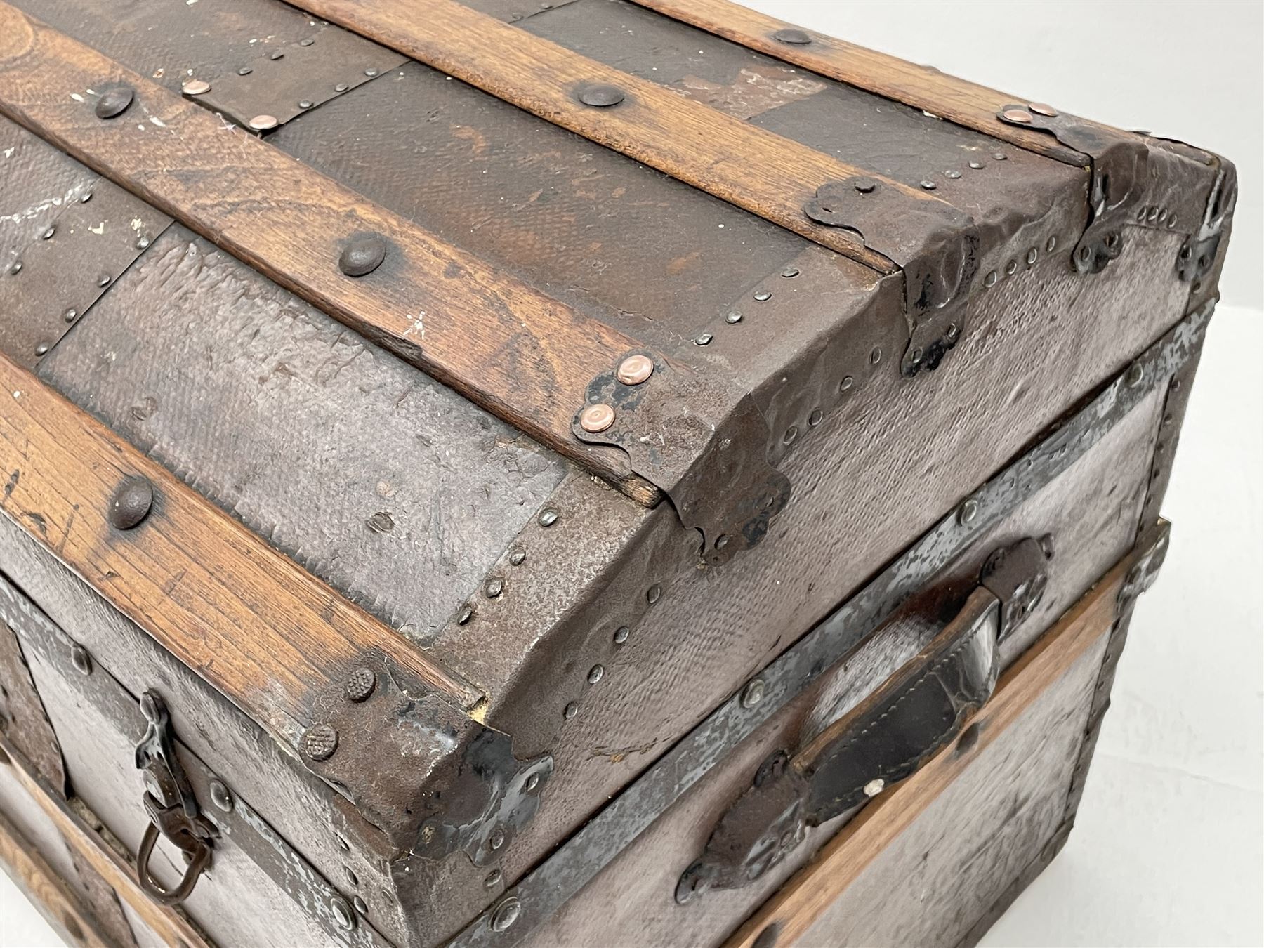 Early 20th century wood and metal bound trunk with dome hinged top