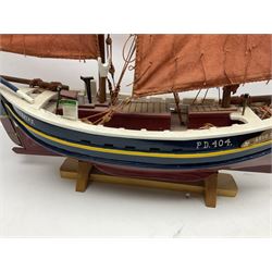 Wooden model of the Peterhead Herring Fishing Boat, Love Divine, PD404. on stand together with Wick Herring Fishing Boat, Galilee WK.1. on stand, L105cm, H64cm