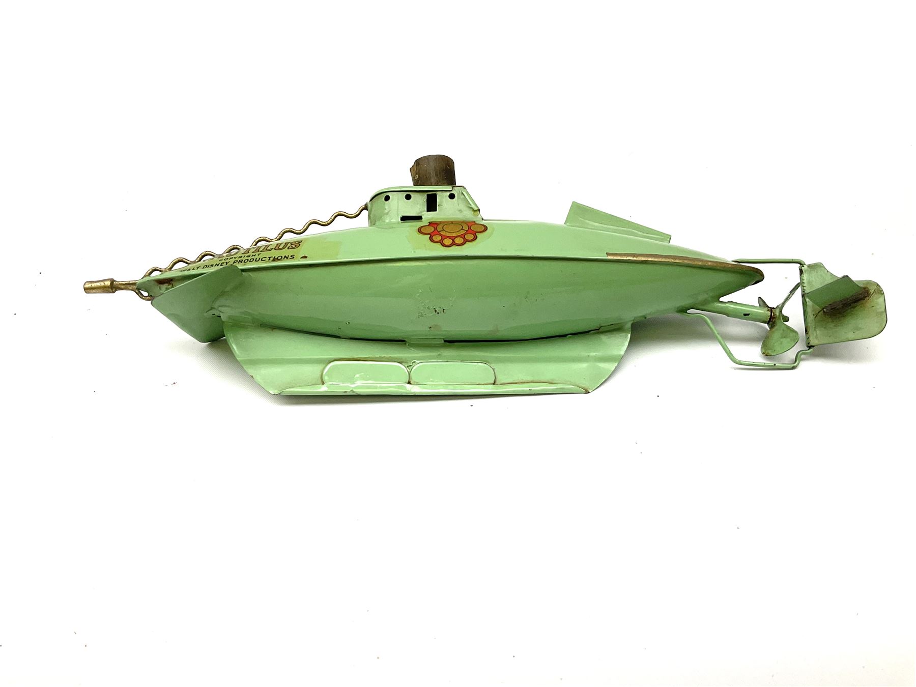 Sutcliffe Models ‘Nautilus’ tinplate and clockwork submarine from Walt Disney’s ’20,000 Leagues Under The Sea’ by Jules Verne, sea green body with various decals, rubber bung with periscope, boxed with inner cardboard display piece, produced between 1955-1960