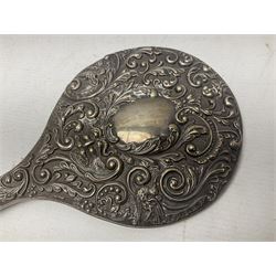 Silver mounted dressing table mirror, embossed with birds, masks, and foliate and C scrolls, hallmarked Birmingham, and fruit knife with mother of pearl handle and silver blade, (2)