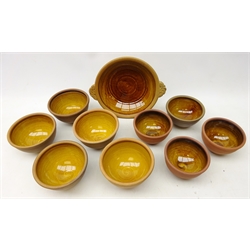  Peter and Jill Dick for Coxwold pottery, nine bowls with slip glaze and a two handled bowl, each with impressed mark (10)  
