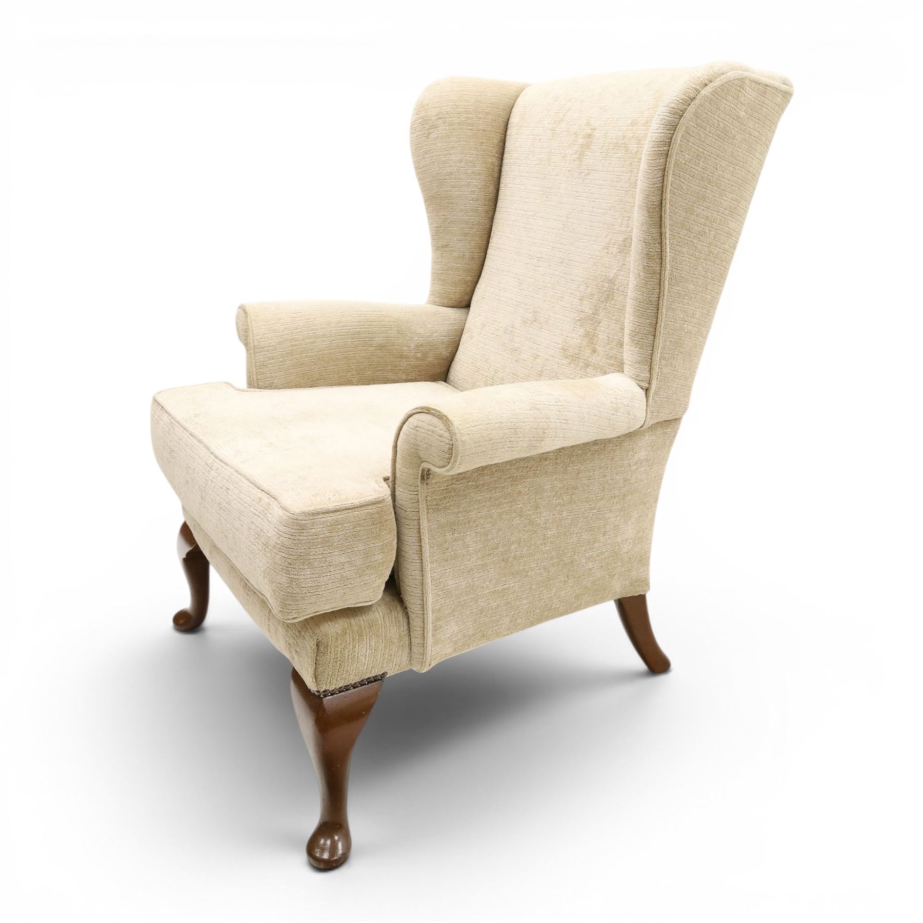 Parker Knoll - 'Hartley' lounge suite, comprising three wingback armchairs and two-seat settee, upholstered in cream fabric, shaped wing backs with scroll-over arms and loose seat cushions, on cabriole supports with pad feet wingbacks and settee

Armchairs: H 96cm, D 83cm, W 75cm
