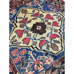 Old Baluchi rug, with panels depicting buildings and stylised flower motifs