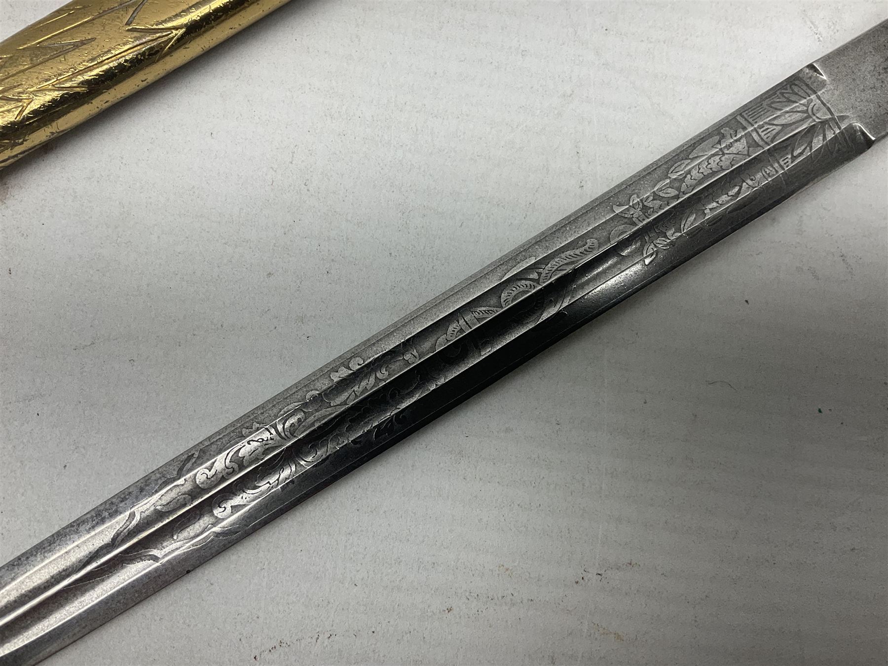 WW2 German kreigsmarine style dagger composed from various age parts, the post-war 25cm double fullered blade  with etched decoration and inscribed WKC with knight's head; in gilt brass scabbard with two rings L42cm overall