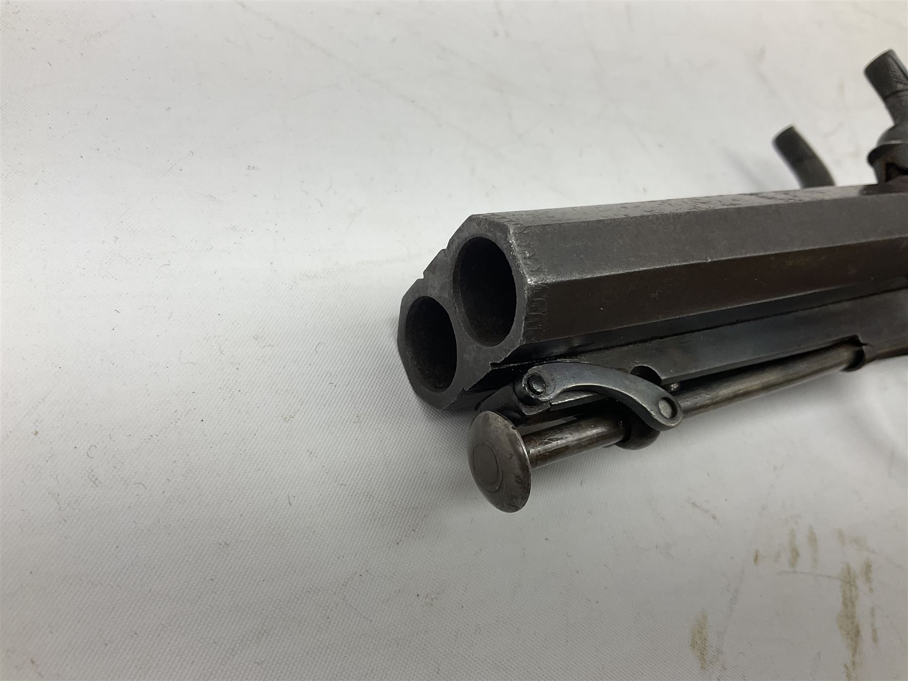 Early 19c percussion double barrel Howdah pistol by J. Blisset London, c1840s, approximately 50 calibre, 10.5cm octagonal monobloc barrels with captive swivel ramrod under, finely chequered walnut stock, engraved hammers, lock plates, tang and trigger guard, butt plate with hinged cap compartment, vacant white metal oval escutcheon L25.5cm overall