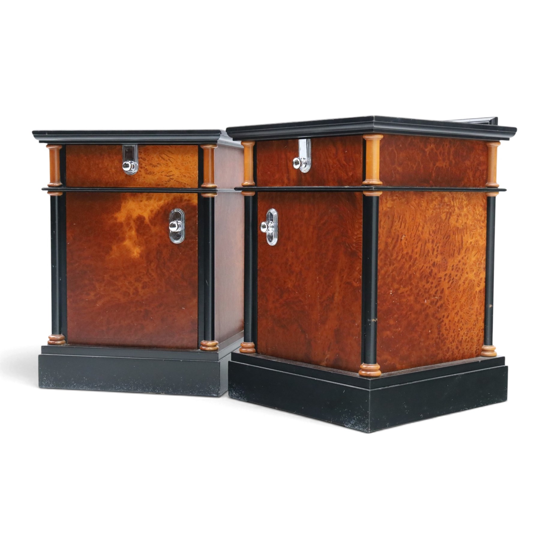 Pair of Art Deco design burr walnut and ebonised bedside cabinets, rectangular inset tops with raised rear galleries, each fitted with a drawer above a cupboard, flanked by cylindrical columns, on plinth bases