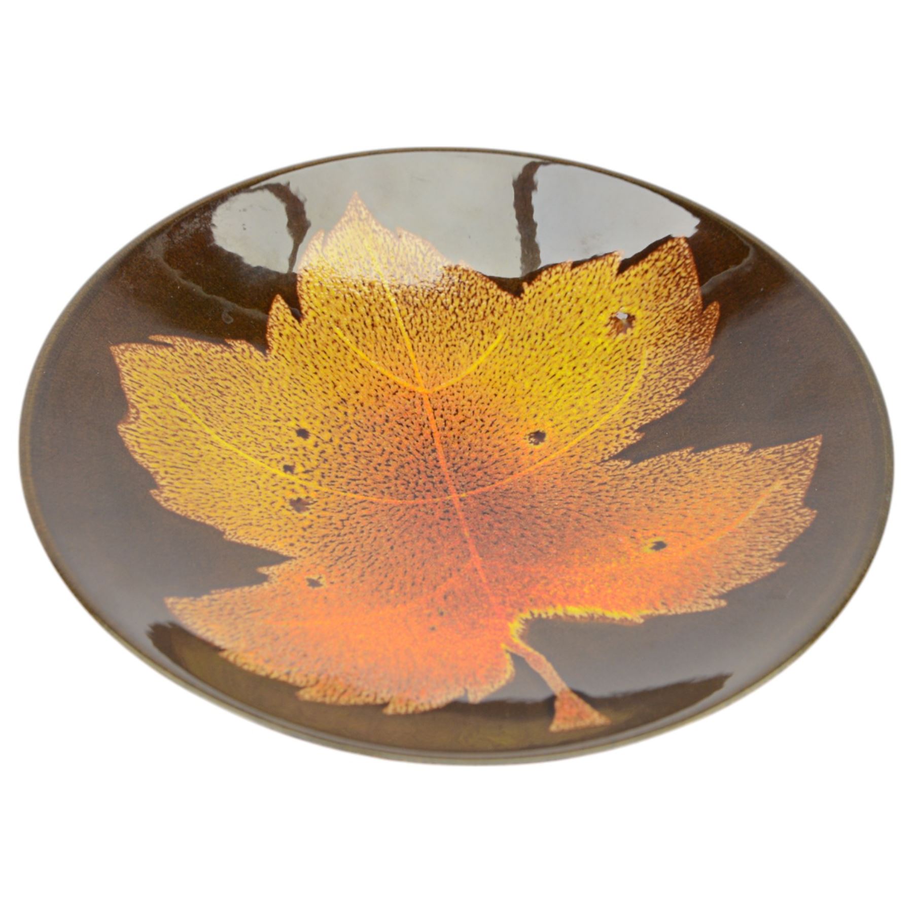 Three Poole pottery chargers, in Wild Poppy pattern, Delphis pattern and Aegean pattern, together with a Poole pottery dish and plate  