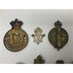 Fourteen cap badges of Irish interest including Royal Dublin Fusiliers inscribed to the slider 'From A. O'Connor 2nd Batt. Dec.2nd 1915', Connaught Rangers, South irish Horse Yeomanry, Inniskilling Fusiliers, Royal Irish Regiment etc; and seven Welsh badges including South Wales Borderers, Welsh Guards, 3rd Bn. Monmouthshire Regt. etc (21)