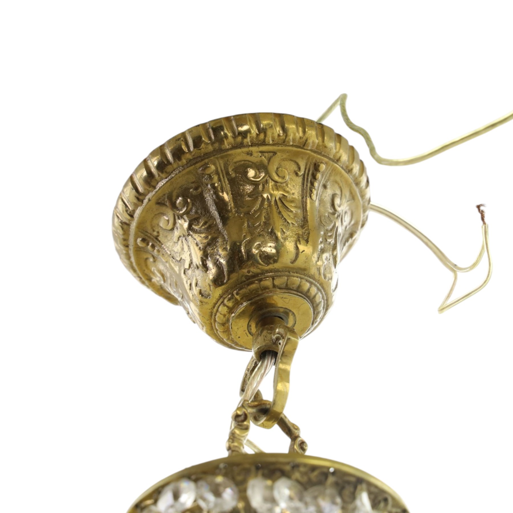 Empire design brass and crystal chandelier, the two circular brass tiers with foliate mounts, connecting the cascading crystal garlands, with prismatic drops