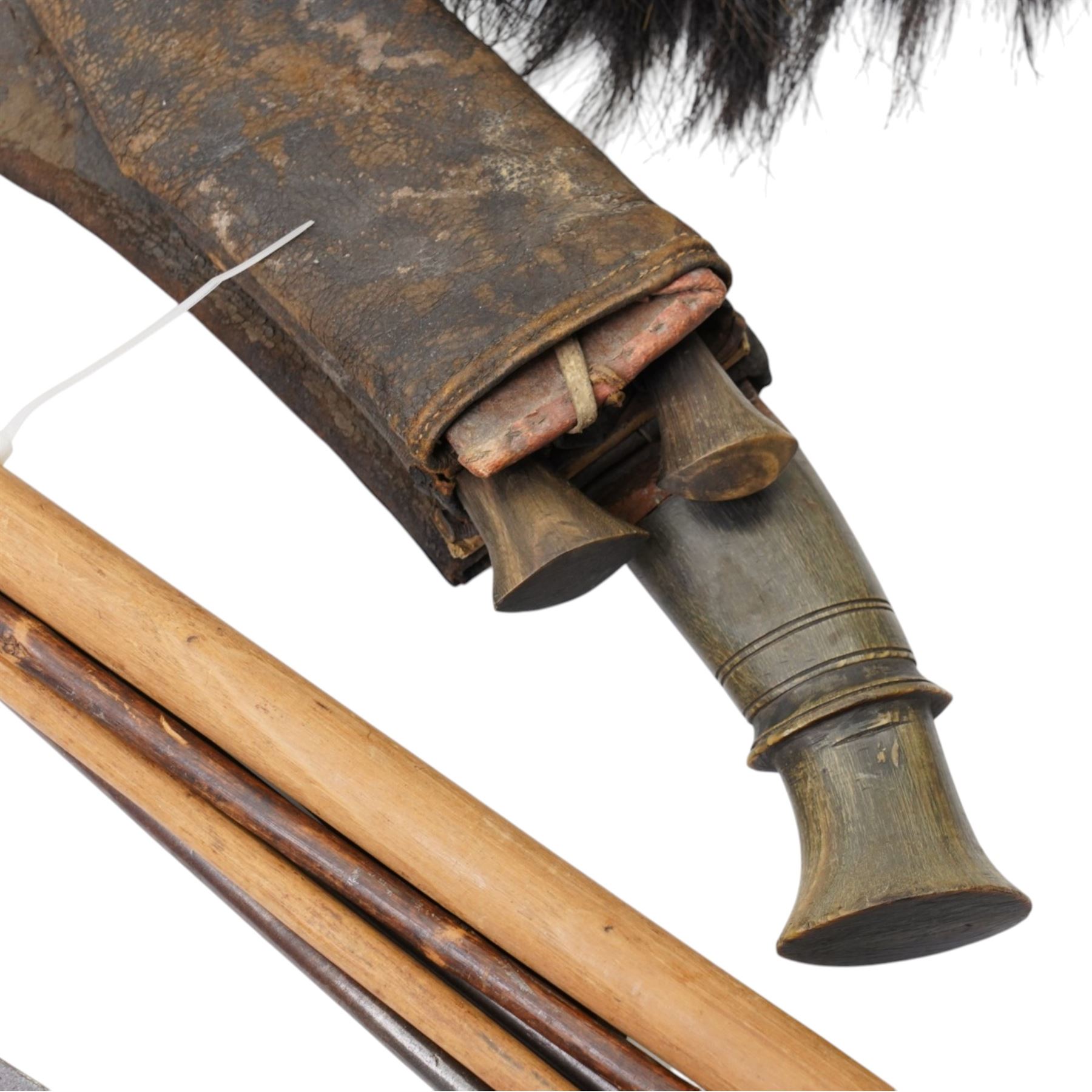 Nepalese kukri with skinning knives in leather scabbard, horse hair and leather sporran by Leckie Graham & Co 1900, Burmese sword, African spears and a military print