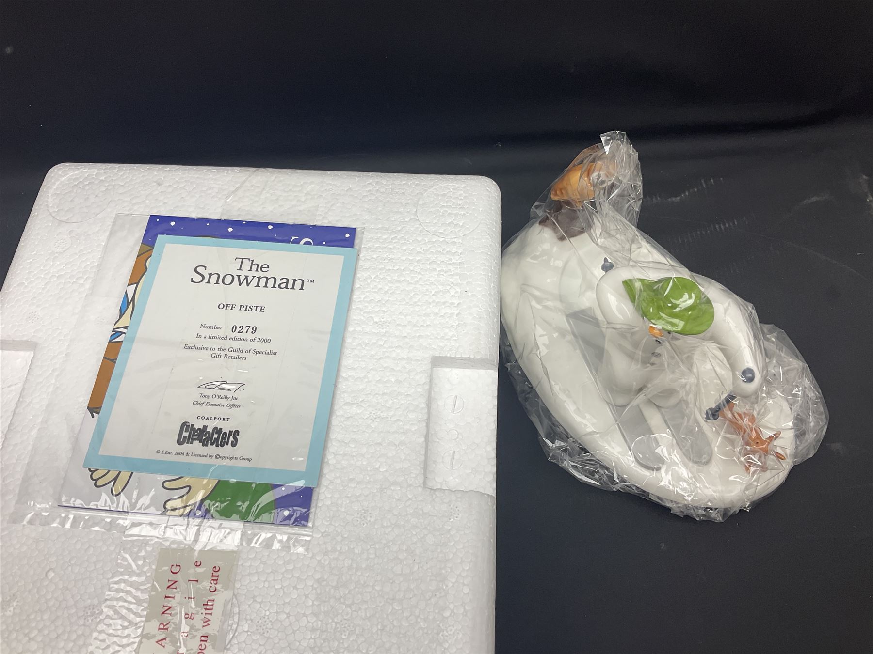 Three Coalport Characters The Snowman figures, comprising Dinner for Two, Off Piste and Winter Fun, all with certificates and original boxes 