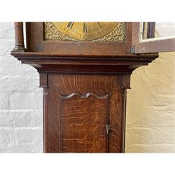 18th century c1760 oak cased George III longcase clock by William Eastwood of Burnley, with a stepped caddy top on a projecting cornice and blind frieze, square glazed door flanked by two turned pillars with gesso capitals, trunk with conforming recessed pillars and a full length wavy topped door, on a square plinth with a raised panel and shaped skirting, 12” square brass dial, 11” chapter ring with Roman numerals and five-minute Arabic's,  
