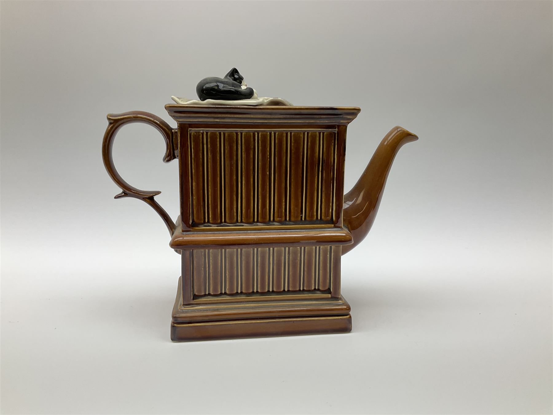 Three Ringtons novelty teapots, comprising The Ringtons Van teapot, the Tea Merchant teapot, and Millenium Celebration teapot. 