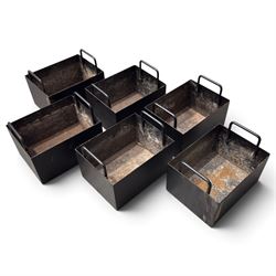 Black-painted iron herb planter, the long rectangular body embossed ‘Thyme, Basil, Oregano, Parsley, Mint’ with applied foliate decoration, containing five removable handled liners