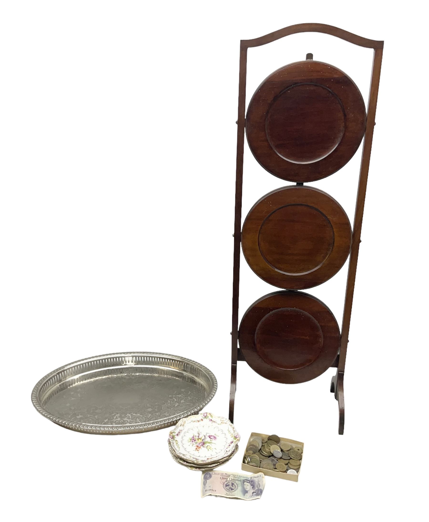 Set of four Dresden dessert plates hand painted with flowers and gilt scrolls, together with silver plate serving dish, a mahogany folding cake stand and a collection of coins