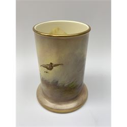 A Crown Devon Fieldings vase, of cylindrical form painted with a highland cattle scene and signed Cox, with printed marks beneath, H11.5cm