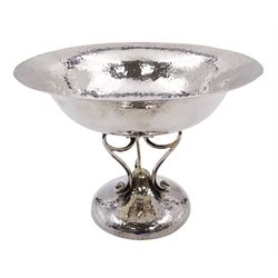 Early 20th century Arts & Crafts silver tazza, the circular planished bowl supported by three curved supports upon a circular spreading planished base, hallmarked Walker & Hall, Sheffield 1909