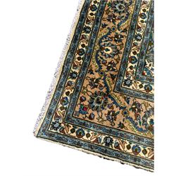 Persian Kashan rug, ivory ground and decorated with interlacing plant motifs in blue, central medallion, seven band border, the main band with repeating floral design