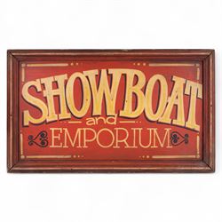 'Showboat and Emporium' painted wooden sign, yellow lettering on a red ground, H54cm, W91cm
