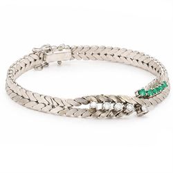 14ct white gold diamond and emerald crossover bracelet, the central section set with five graduating round brilliant cut diamonds and five emeralds, to a chevron link bracelet, stamped 585, total diamond weight 0.35 carat