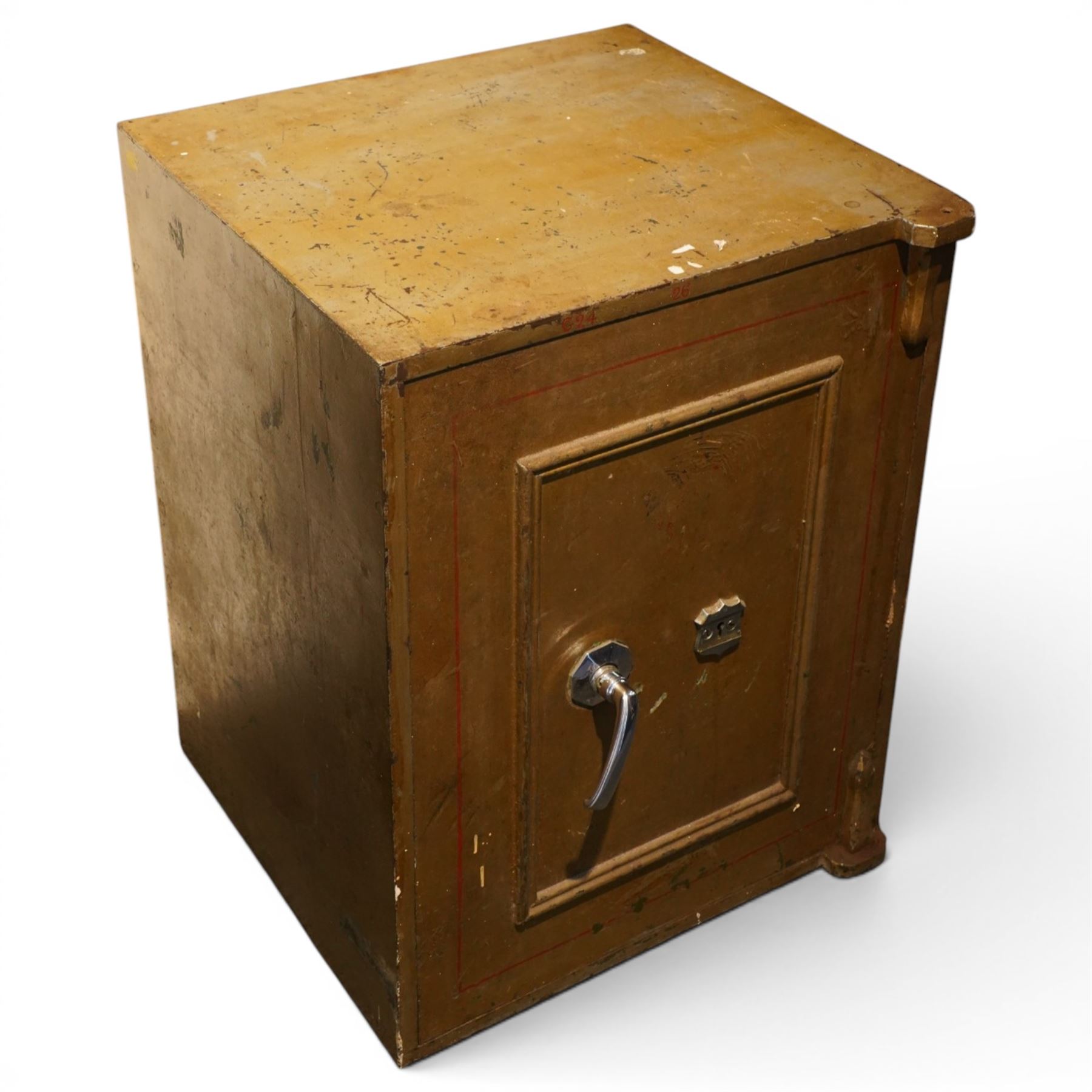 Early 20th century painted iron and steel safe, square form with moulded panel door, applied handle and lock plate with three keys, the interior fitted with twin cash drawers with recessed handles, on low cast feet