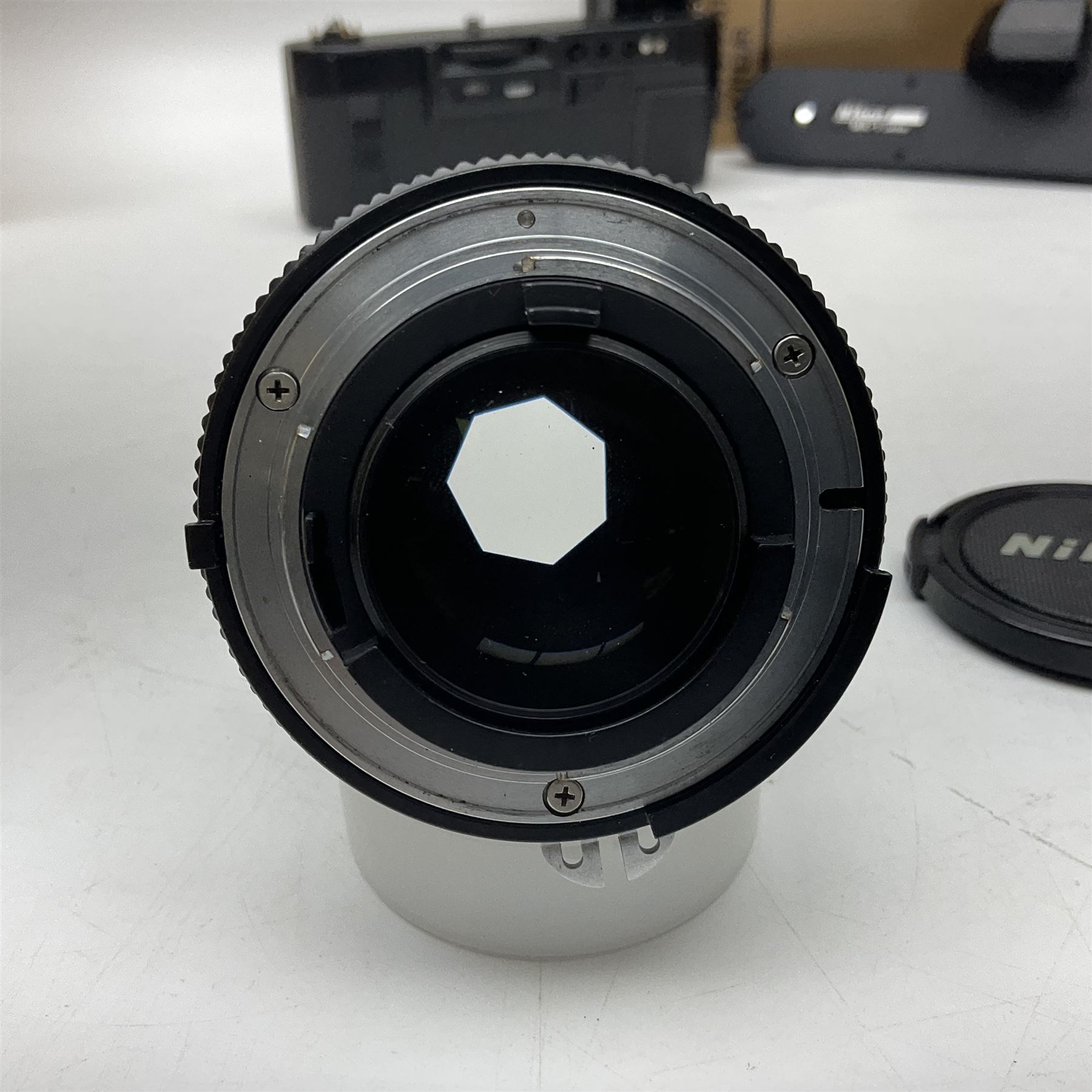 Nikon F3T camera body, in champagne/ titanium colourway, serial no. T8215031, with 'Nikon Nikkor 50mm 1:1.4' lens, Nikon MD4 motor drive, serial no. 156592 and Nikon MK-1 Firing range converter, all with original boxes 