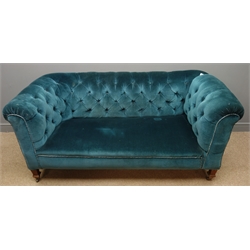  Early 20th century two seat Chesterfield drop end sofa, upholstered in deeply buttoned dark teal fabric, tapering supports, W165cm  