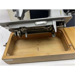 Seamstress sewing machine in case, together with a Singer sewing book