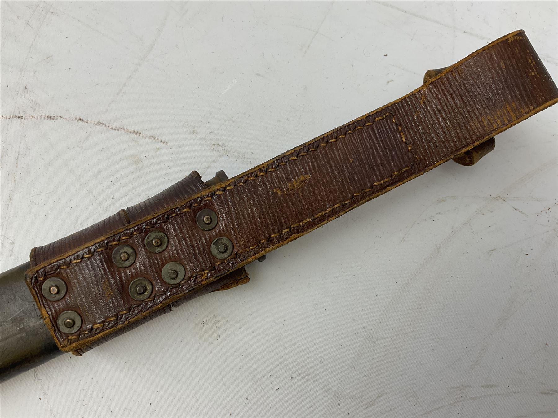 WW1 American Model 1917 Enfield bayonet by Remington with 43cm fullered steel blade; in leather scabbard with frog L59cm overall; and American M5A1 knife bayonet marked MILPAR COL to the cross-piece (no scabbard) (2)