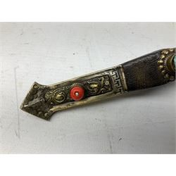 Tibetan small dagger, the 9cm steel blade with horn and brass grip set with a red stone, and matching stylised fish scabbard L19cm overall