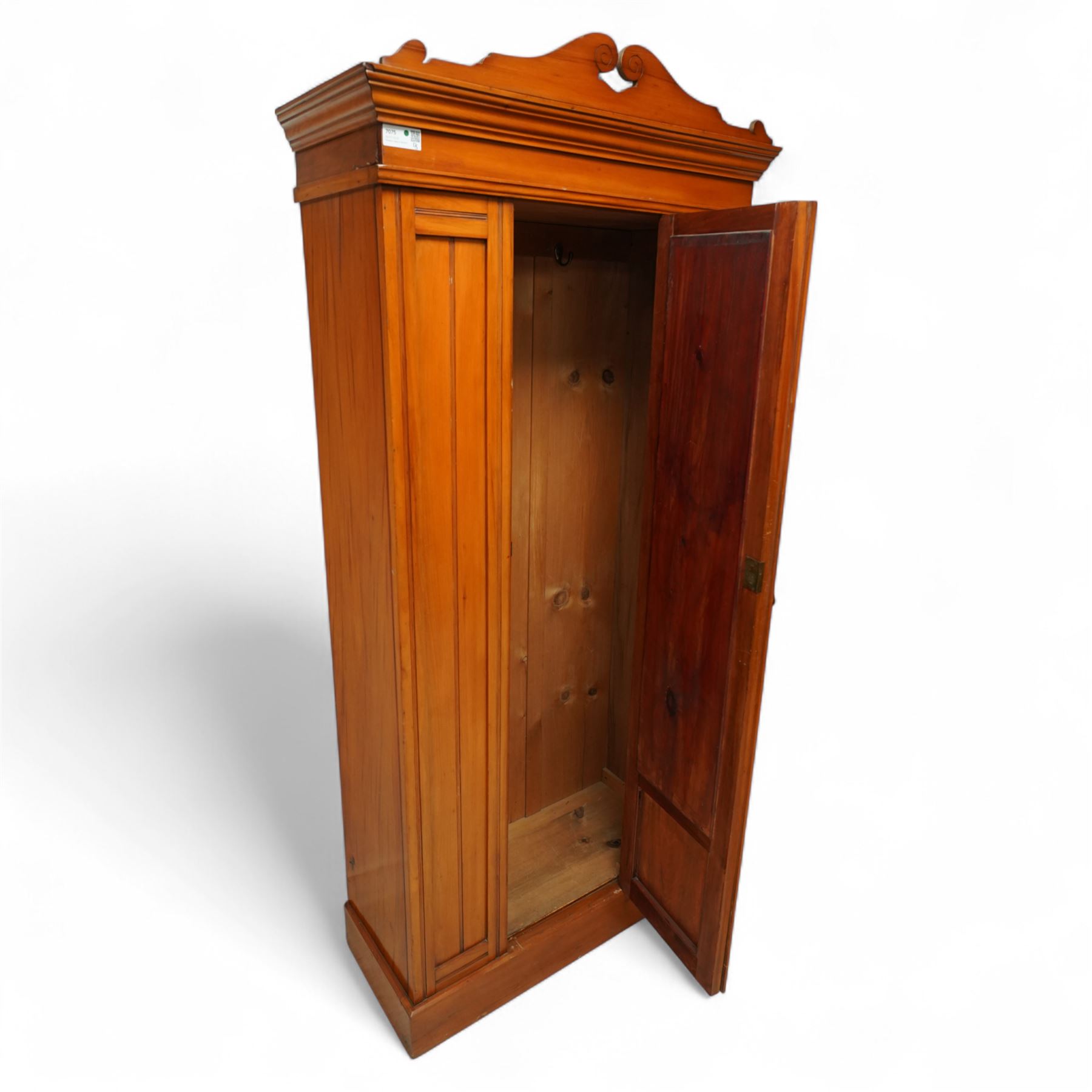 Early 20th century satin walnut wardrobe and dressing table, including a tall single wardrobe with mirrored door beneath a shaped cornice and moulded pediment, (H 205cm, D 39cm, W 91cm) and a matching dressing chest with glazed lift-top compartment and three drawers, mirror supported by scrolled uprights with flanking open shelves (H 170cm, D 45cm, W 84cm)