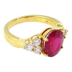 18ct gold ruby and diamond ring, single oval cut ruby of approx 5.35 carat, with three round brilliant cut diamonds set either side, stamped, total diamond weight approx 1.00 carat