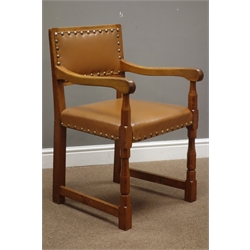  'Lizardman' carver armchair upholstered in tan leather with stud detail, by Martin Dutton of Huby, York, W53cm  