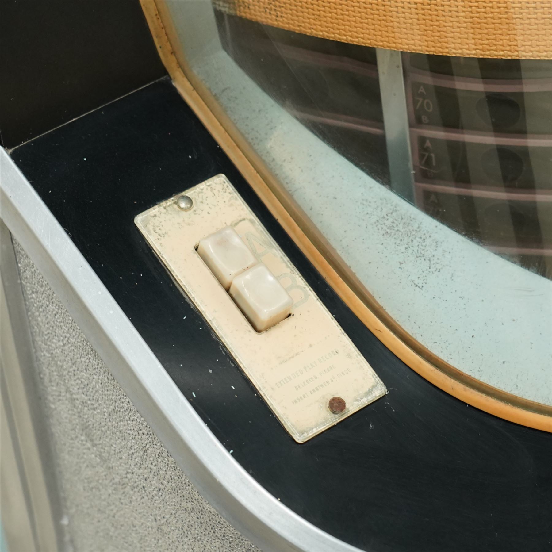 Ditchburn - 'Music Maker Panoramic 200' jukebox circa 1959, curved panoramic glazed front offering full view of the automatic selection process, accommodating 100 records (200 selections), with a stereo sound system, the aluminium trim over a woven speaker grille with an all-over ebonised and silver finish